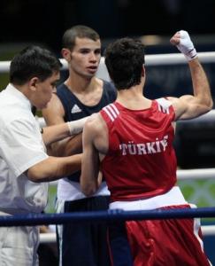 Turkey's Yakup Kilic (R) is declared winner after defeating