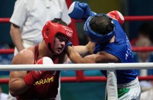 Ukraine's Vyacheslav Glazkov (L) fights against Algeria's Newfel Ouatah
