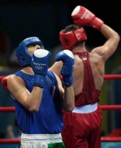 Ukraine's Vyacheslav Glazkov (R) celebrates his victory over disappointed