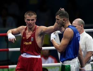 Ukraine's Vyacheslav Glazkov (L) is declared winner after defeating