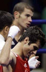 Yakup Kilic of Turkey, front, reacts after defeating Abdelkader