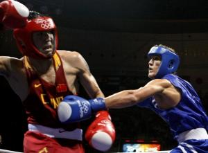 Zhang Xiaoping (L) of China fights Abdelhafid Benchabla of