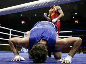 Abdelhafid Benchabla of Algeria reacts after losing to Zhang
