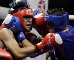 Zhang Xiaoping of China, left, fights Abdelhafid Benchabla of