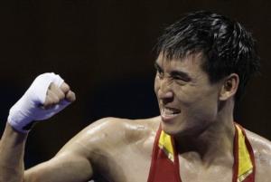 Zhang Xiaoping of China reacts after defeating Abdelhafid Benchabla