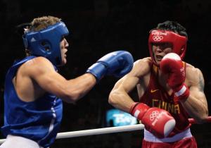 China's Xiaoping Zhang (R) fights against Algeria's Abdelhafid Benchabla