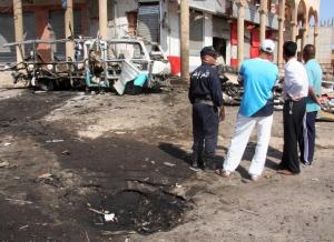Police investigates at a site of a bomb attack