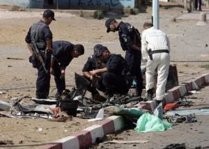 Police investigates at a site of a bomb attack