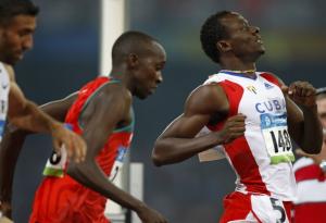 Yeimer Lopez of Cuba slows down after crossing the