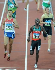 Kenya's Wilfred Kipkemboi Bungei (R) crosses the finish line