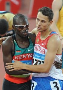 Kenya's Wilfred Kipkemboi Bungei (L) is congratulated by Russia's