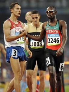 Algeria's Nadjim Manseur stands behind Russia's Yuriy Borzakovskiy (L)