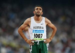 Algeria's Nabil Madi looks at his score following the