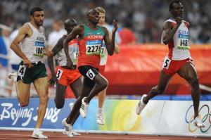 Cuba's Yeimer Lopez (R) runs ahead of Kenya's Boaz