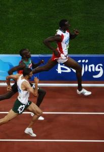 Cuba's Yeimer Lopez (R) runs ahead of Kenya's Boaz