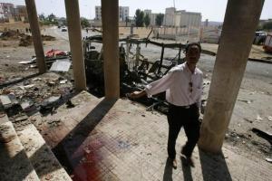 A resident talks to a photographer as he walks
