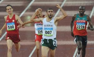 Algeria's Nabil Madi (front) celebrates as he crosses the