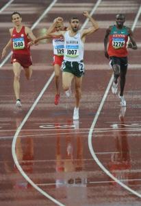 Algeria's Nabil Madi (front) celebrates as he crosses the