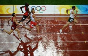 Algeria's Nabil Madi (R) runs ahead of Canada's Gary