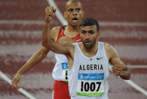 Algeria's Nabil Madi (front) celebrates as he crosses the