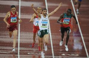 Algeria's Nabil Madi (front) celebrates as he crosses the