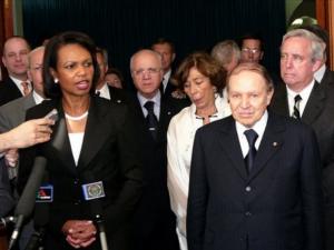 U.S. Secretary of State Condoleezza Rice, left, briefs the
