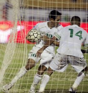 Algeria's Rafik Saifi and Ghilas Kamel Fathi celebrates after