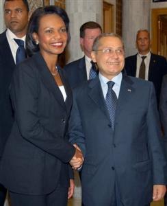 Tunisian Foreign Minister Abdelwahab Abdallah right, greets U.S. Secretary