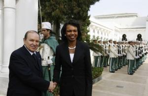 Algeria's President Abdelaziz Bouteflika shakes hands with U.S. Secretary