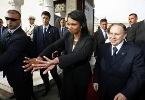 Algeria's President Abdelaziz Bouteflika smiles while U.S. Secretary of