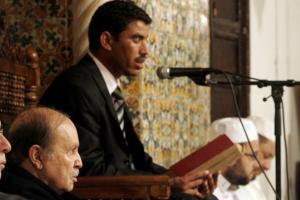 Algeria's President Abdelaziz Bouteflika (L) listens to a recital