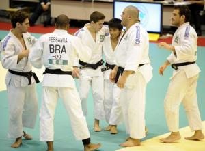 Members of Brazil's judo team celebrate their win over