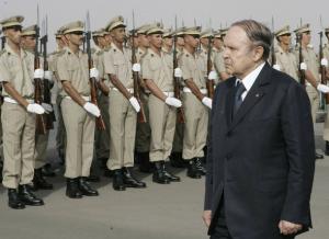 Algeria's President Abdelaziz Bouteflika reviews an honour guard during