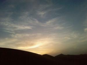 Coucher de Soleil sur le Grand Erg traversant Ouargla