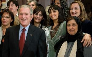 US President George W. Bush poses with participants of