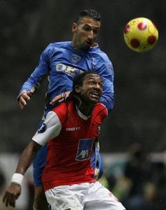 Portsmouth's Nadir Belhadj, left, of Algeria, vies for the