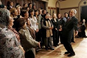 President Bush, right, reacts after posing for a photo