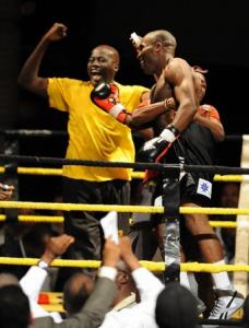 Ivory Coast's (R) Didier Mebara celebrates after defeating Algeria's