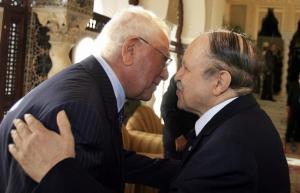 Algeria's President Abdelaziz Bouteflika (R) welcomes former state President