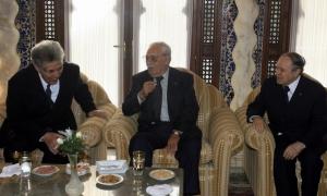 Algeria's President Abdelaziz Bouteflika (R) speaks with former state