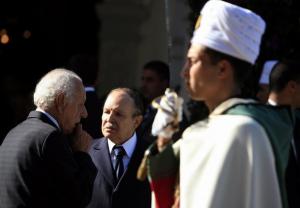 Algeria's President Abdelaziz Bouteflika (R) talks to Boualem Bessaih,