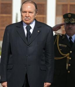 Algerian President Abdelazziz Bouteflika listens to national anthems during