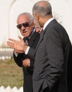 Algerian President of the Constitution council Boualem Bessayeh (L)