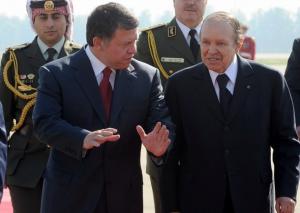 Algerian President Abdelazziz Bouteflika (R) listens to Jordan's King