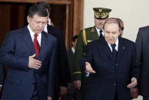 Algeria's President Abdelaziz Bouteflika (R) welcomes Jordan's King Abdullah