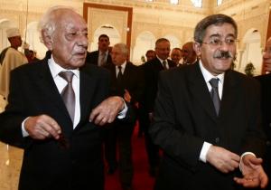 President of the Algerian Constitutional Council Boualem Bessaih (L)
