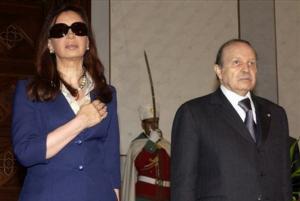 Argentine President Cristina Fernandez, left, is welcomed by Algerian