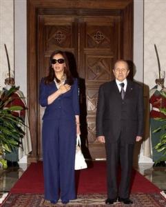 Argentine President Cristina Fernandez, left, is welcomed by Algerian