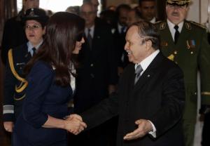 Algeria's President Abdelaziz Bouteflika (R) shakes hands with Argentina's