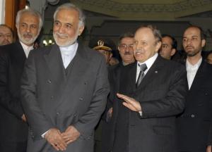 Algeria's President Abdelaziz Bouteflika (R) talks to the media